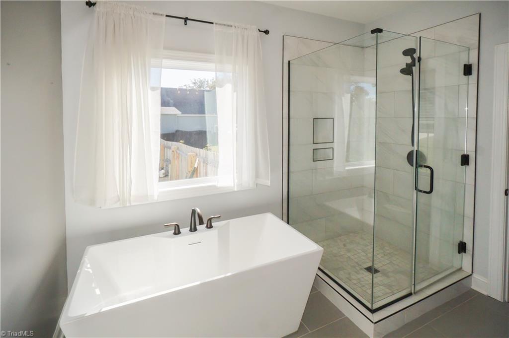 725 Sardis Church Road Madison, NC 27025 - Photo 10 of 21 Free standing Tub and separate shower - Primary suite