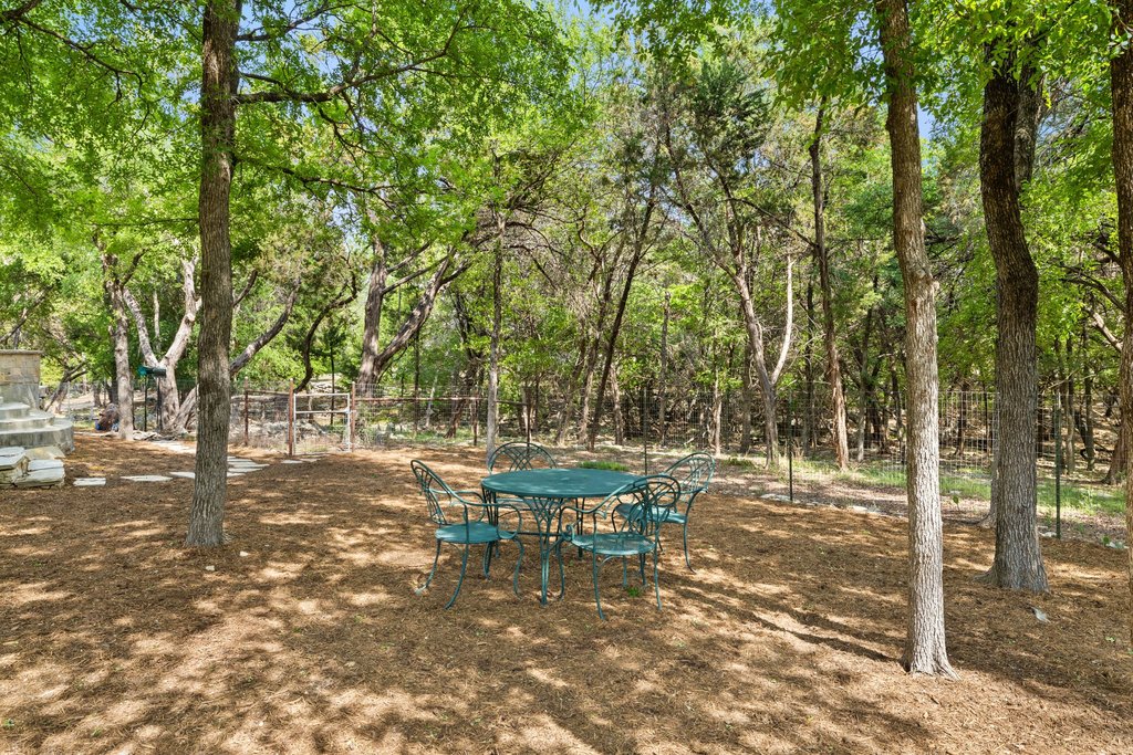 108 Berry Cove Georgetown, TX 78628 - Photo 34 of 39 a view of a yard with plants and trees