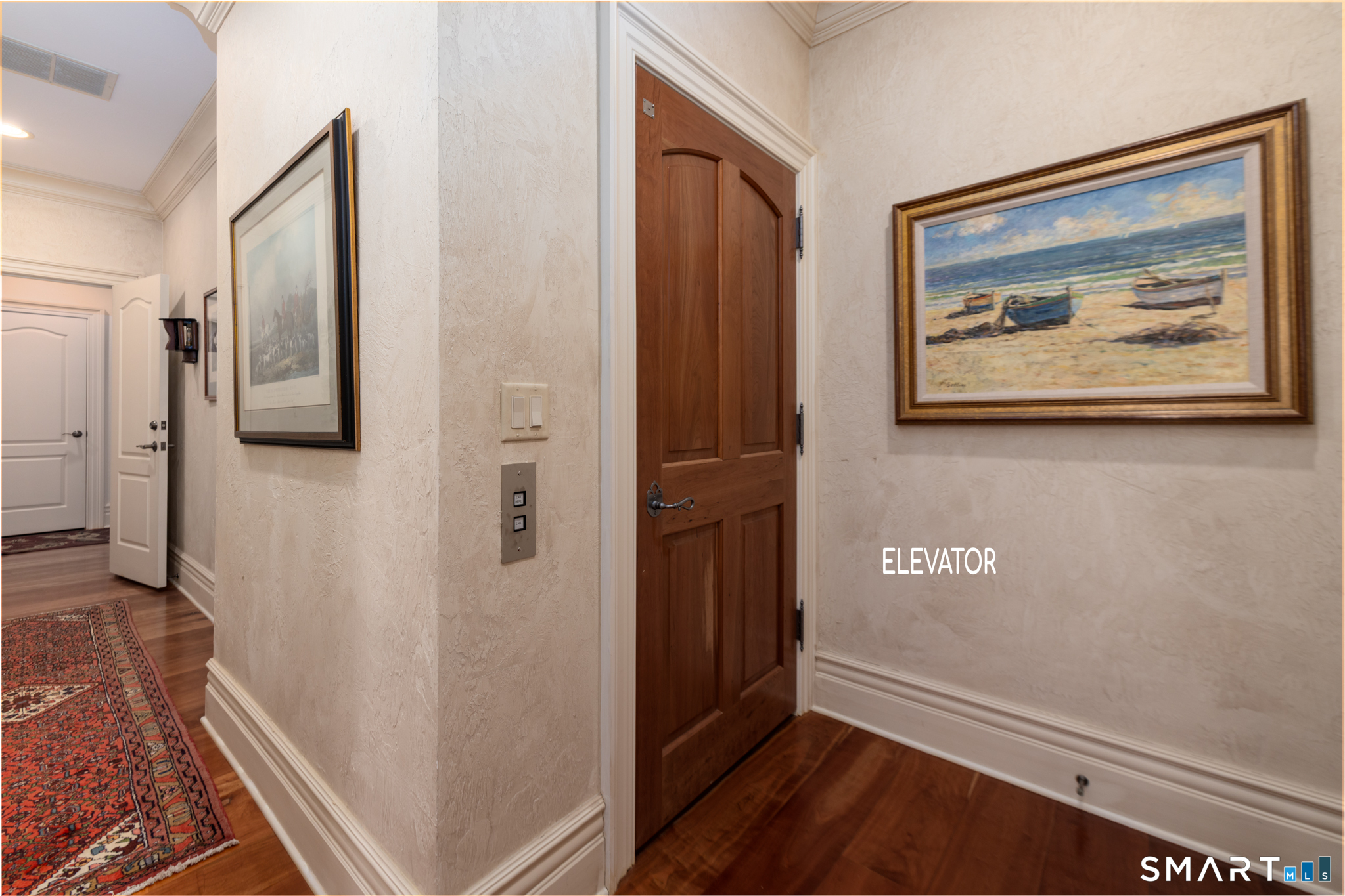 7 Equestrian Ridge Newtown, CT 06470 - Photo 37 of 40 a view of a hallway with wooden floor and cabinet