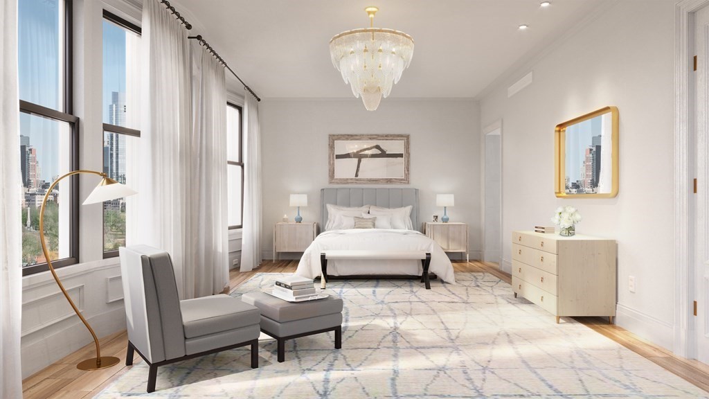 29 Commonwealth Avenue, Unit 6 Boston, MA 02116 - Photo 4 of 8 a spacious bedroom with a bed and a chandelier