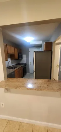 a view of a livingroom with an empty space and a sink
