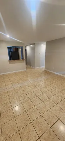 a bathroom with a tub a sink and glass door