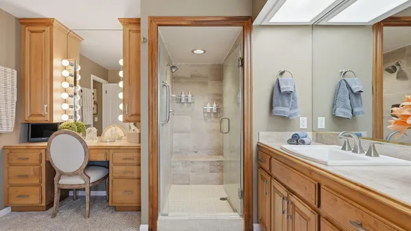 a bathroom with a sink a vanity and a window