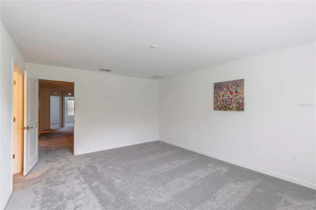 11091 Wishing Cloud Road Land O Lakes, FL 34638 - Photo 12 of 25 an empty room with a bathroom