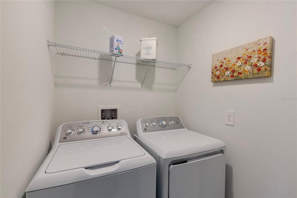 11091 Wishing Cloud Road Land O Lakes, FL 34638 - Photo 21 of 25 a utility room with dryer and washer