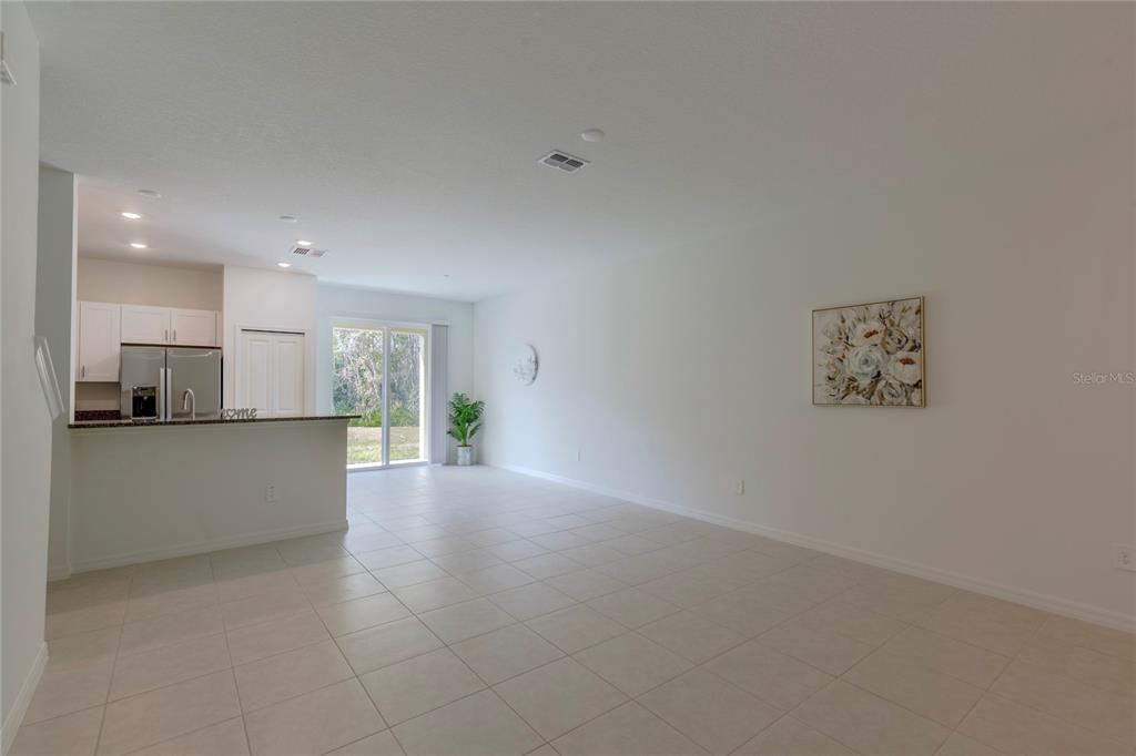 11091 Wishing Cloud Road Land O Lakes, FL 34638 - Photo 4 of 25 a view of a kitchen with a sink and a refrigerator