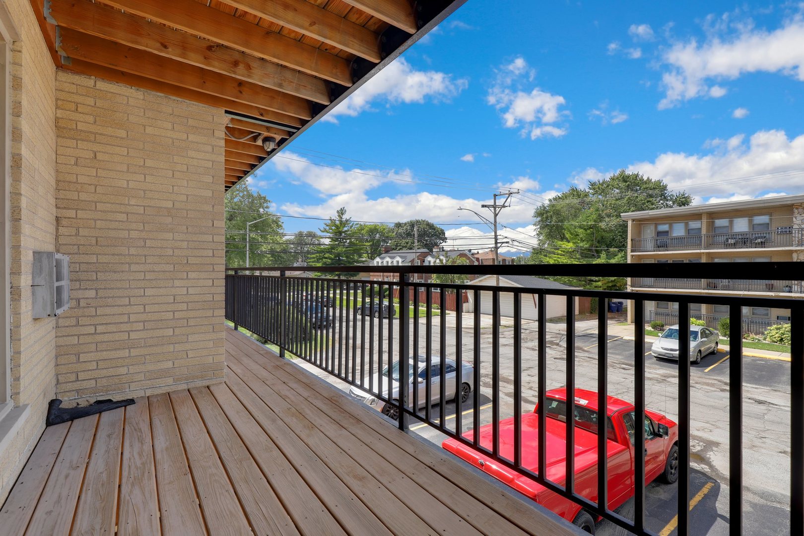 11907 Gregory Street, Unit 3 Blue Island, IL 60406 - Photo 12 of 17 a view of balcony with wooden floor