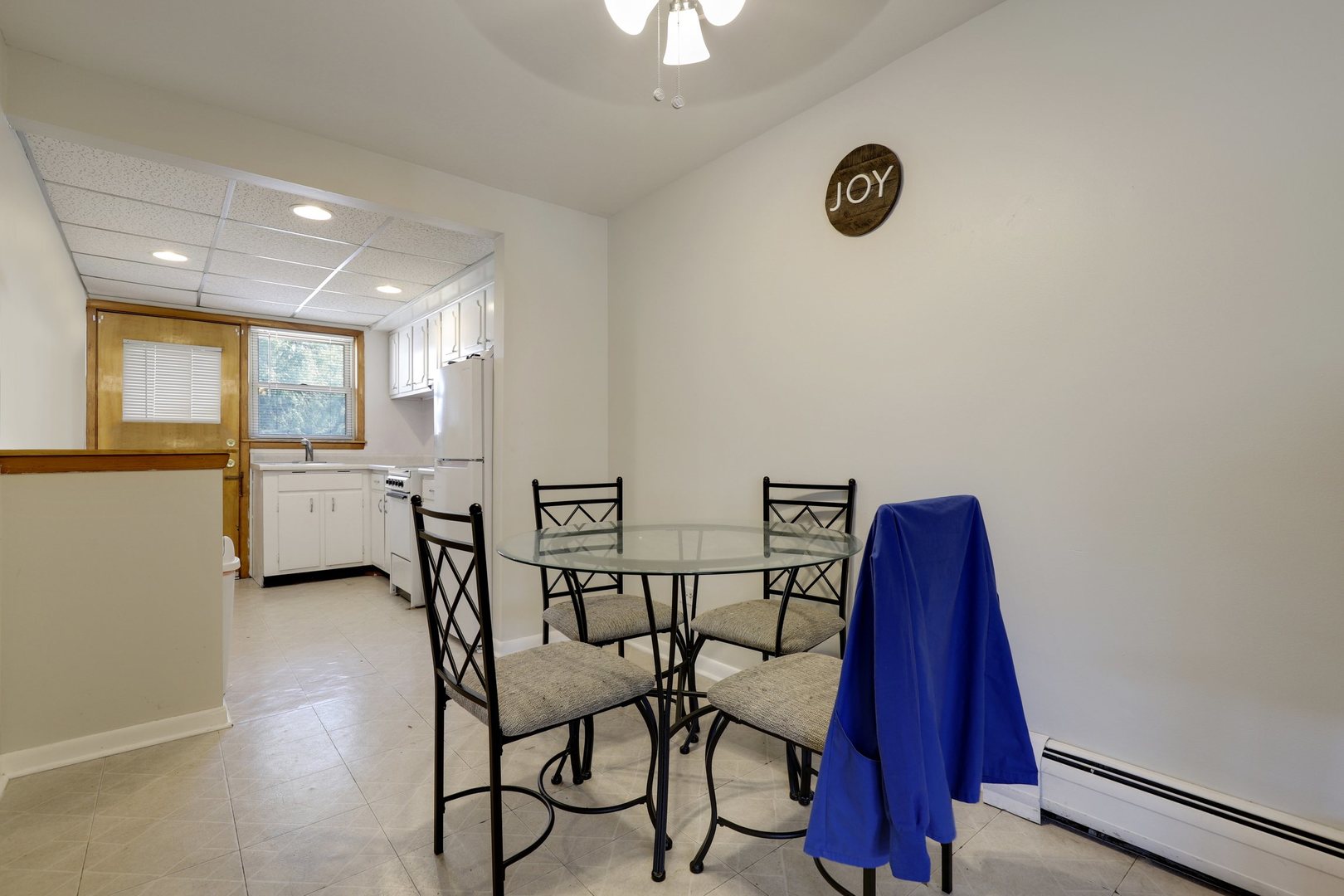 11907 Gregory Street, Unit 3 Blue Island, IL 60406 - Photo 4 of 17 a view of a dining room with furniture and a chandelier
