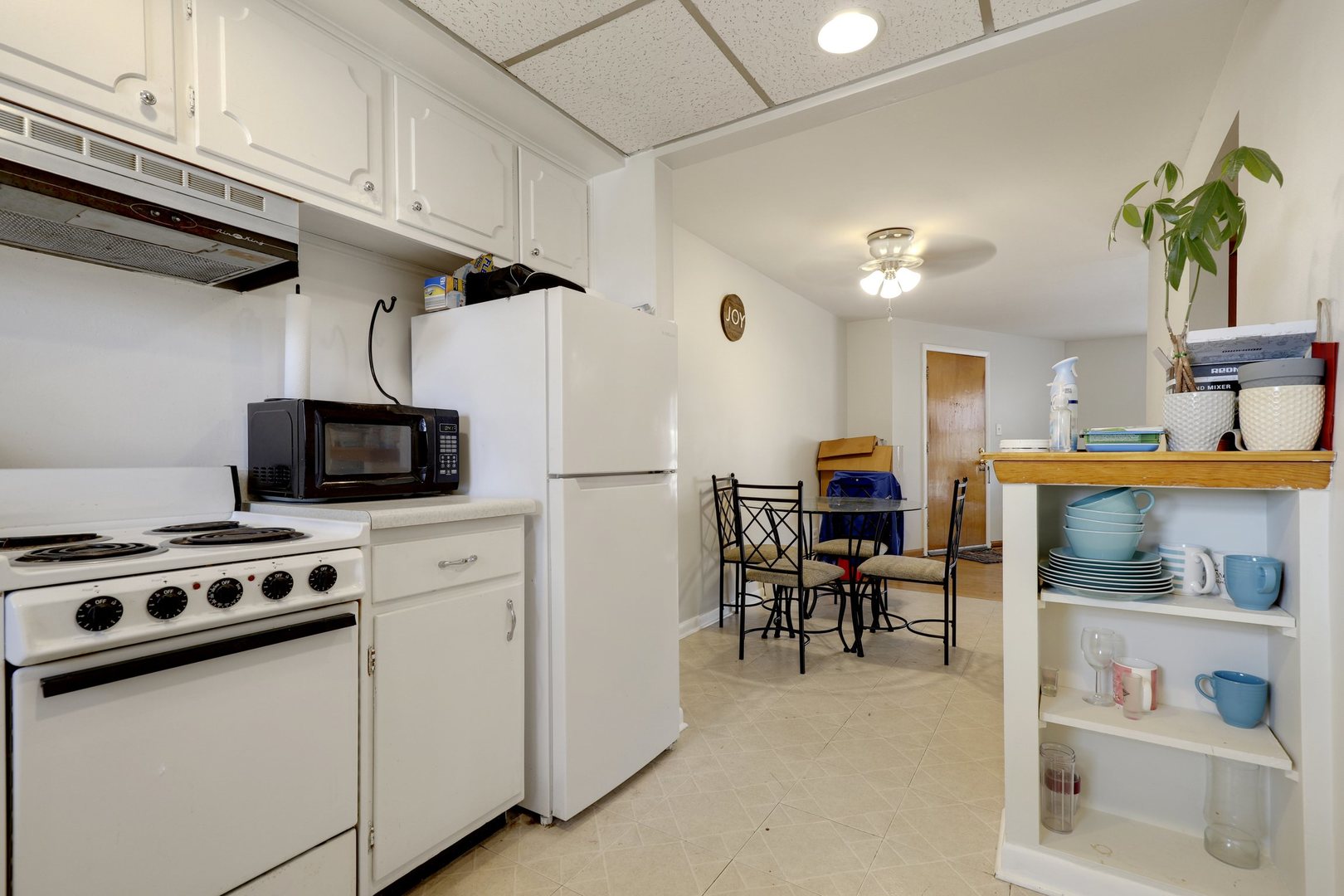 11907 Gregory Street, Unit 3 Blue Island, IL 60406 - Photo 5 of 17 a kitchen with stainless steel appliances a stove a sink and a refrigerator