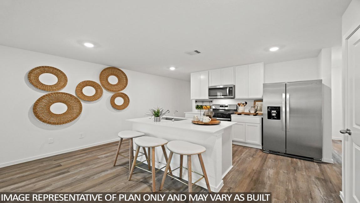 3024 Fall Gold Lane Katy, TX 77493 - Photo 3 of 23 a kitchen with a table chairs refrigerator and cabinets