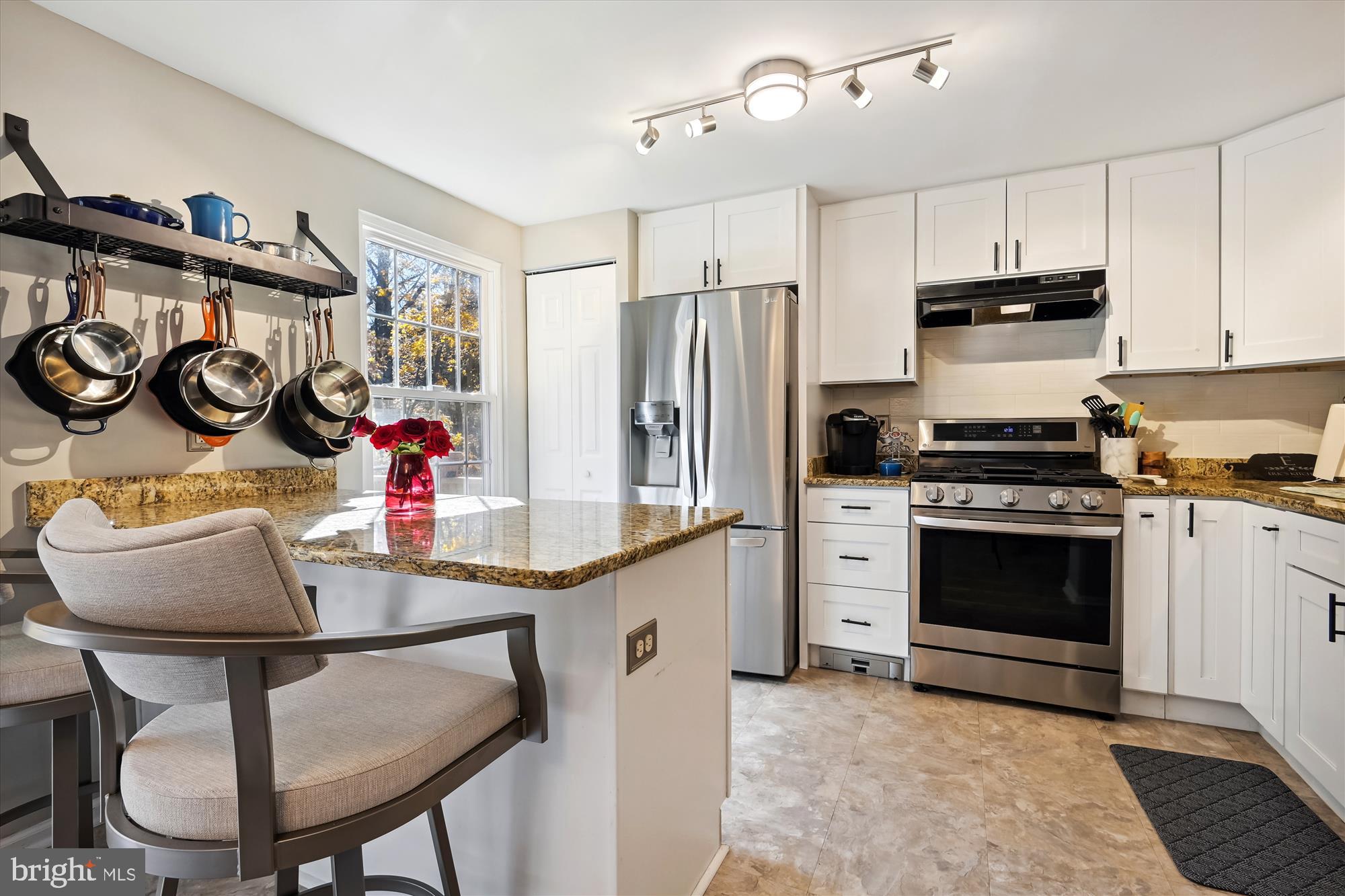1517 Autumn Ridge Circle Reston, VA 20194 - Photo 2 of 37 a kitchen with stainless steel appliances kitchen island granite countertop a stove a sink and a refrigerator