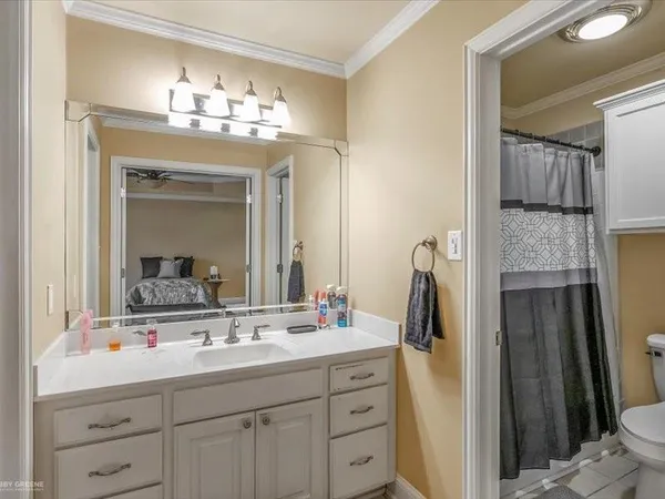 a bathroom with a sink double vanity and a mirror
