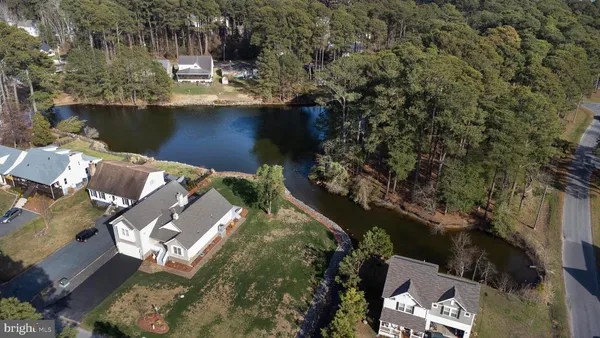 an aerial view of a city with lots of residential buildings lake and ocean view