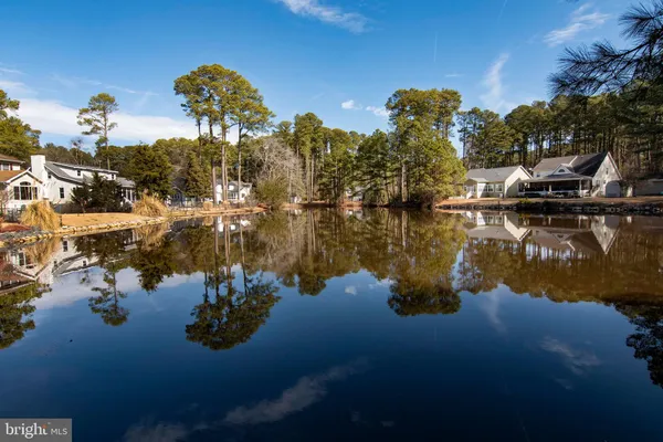 an aerial view of a house with a lake view