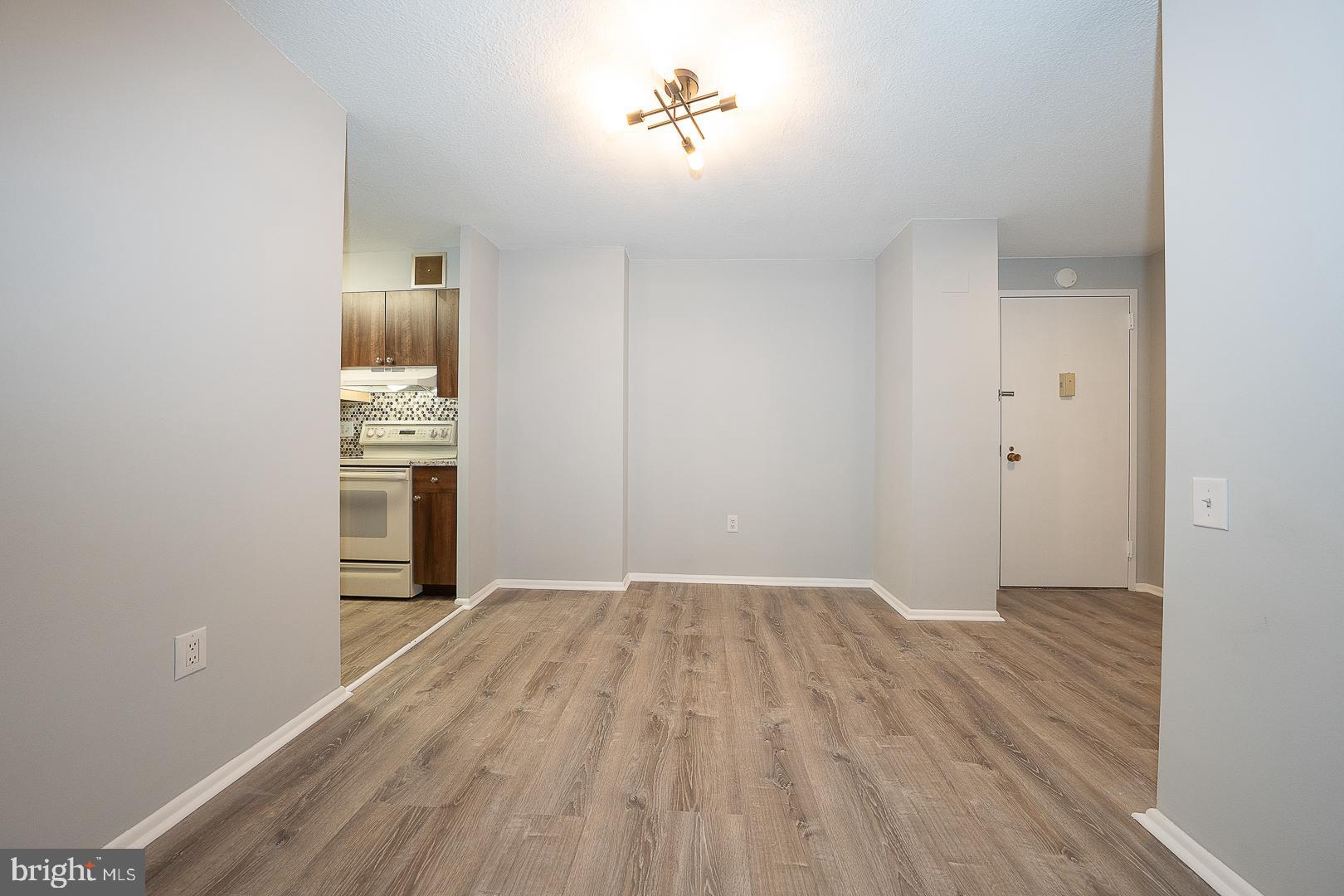 1420 Locust Street, Unit 7E Philadelphia, PA 19102 - Photo 7 of 24 a view of empty room with wooden floor