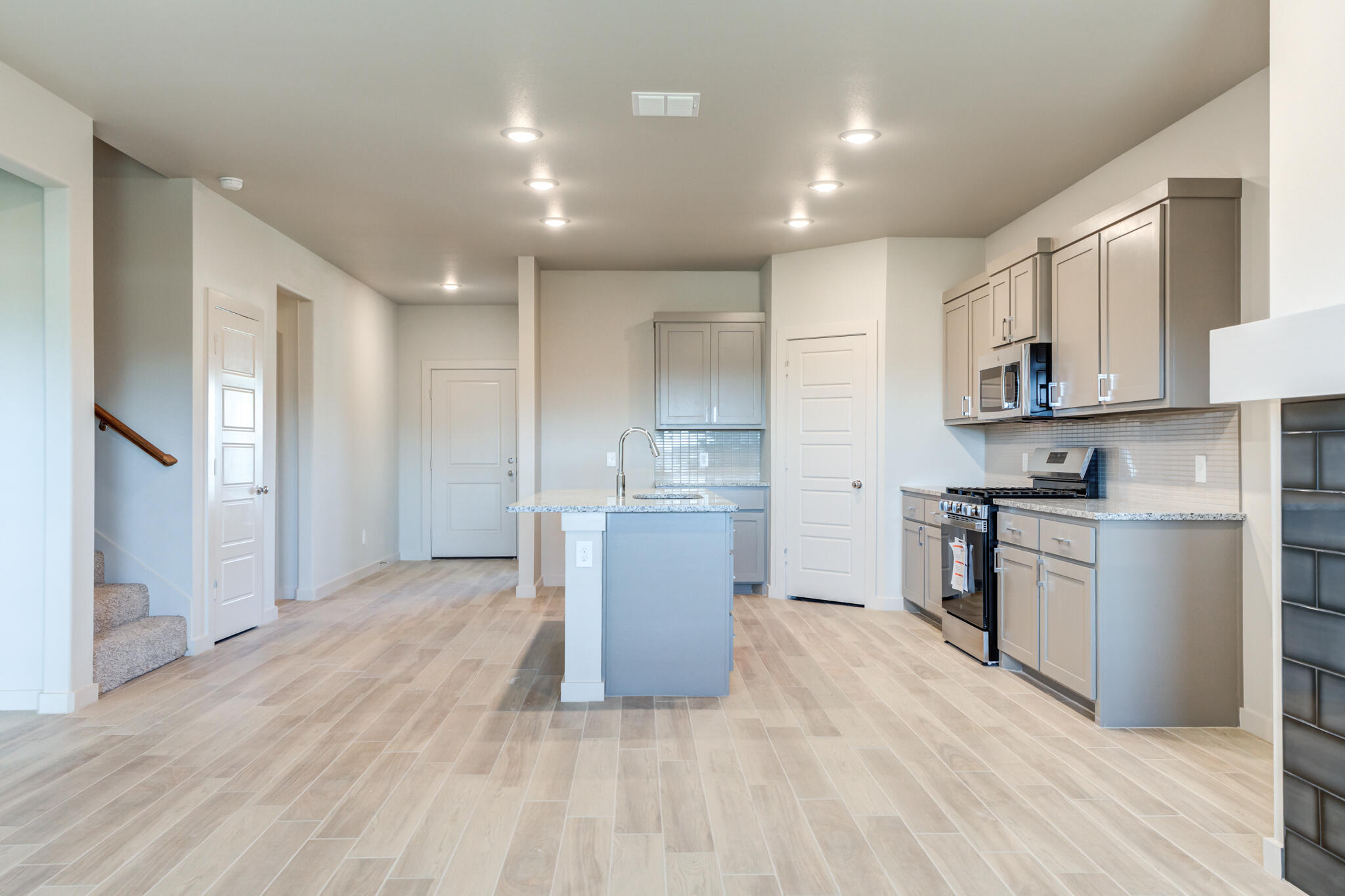 7029 25th Street Lubbock, TX 79407 - Photo 19 of 52 a kitchen with a refrigerator and a stove top oven