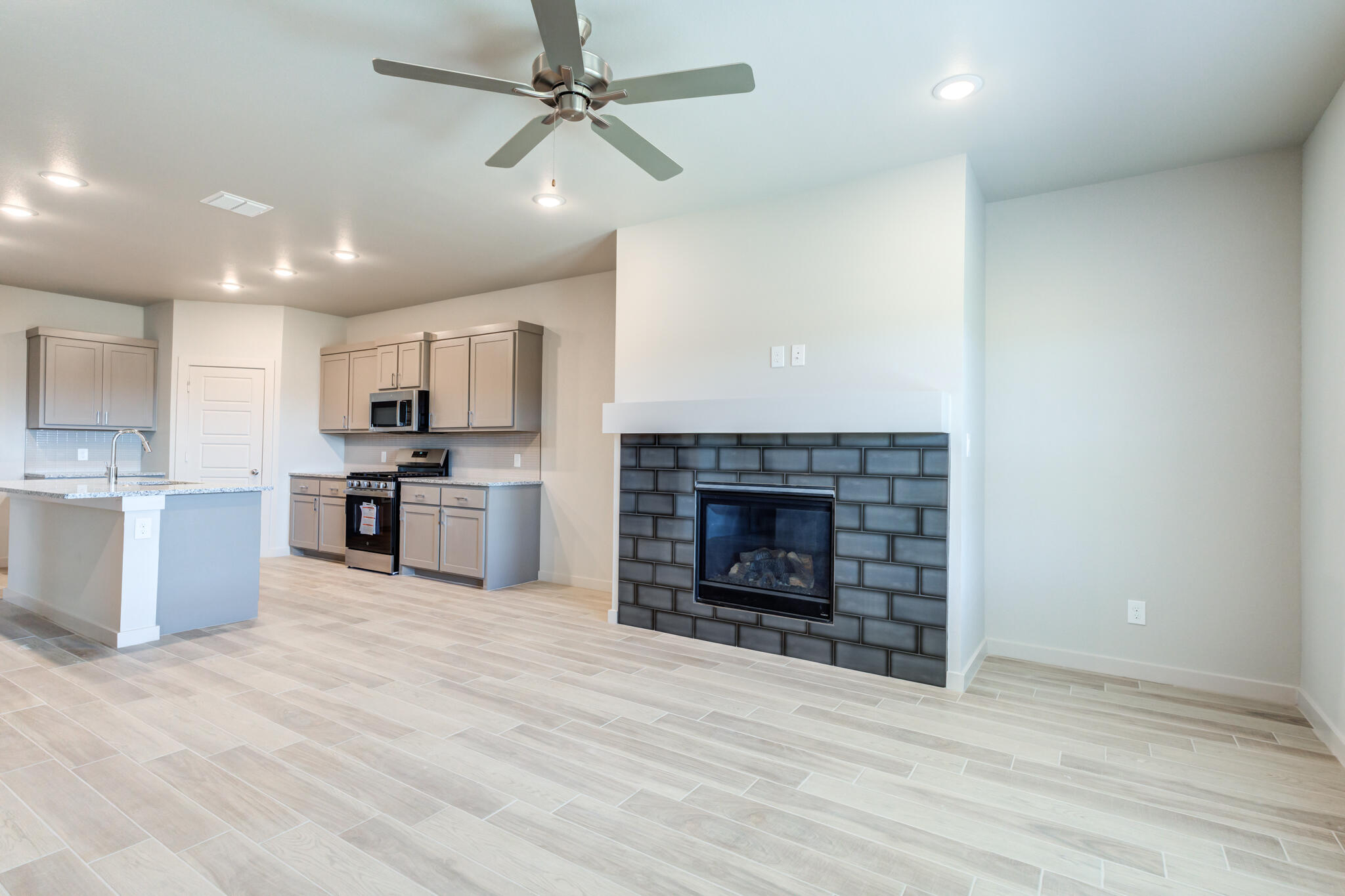 7029 25th Street Lubbock, TX 79407 - Photo 21 of 52 a view of kitchen with kitchen island a sink stainless steel appliances and cabinets