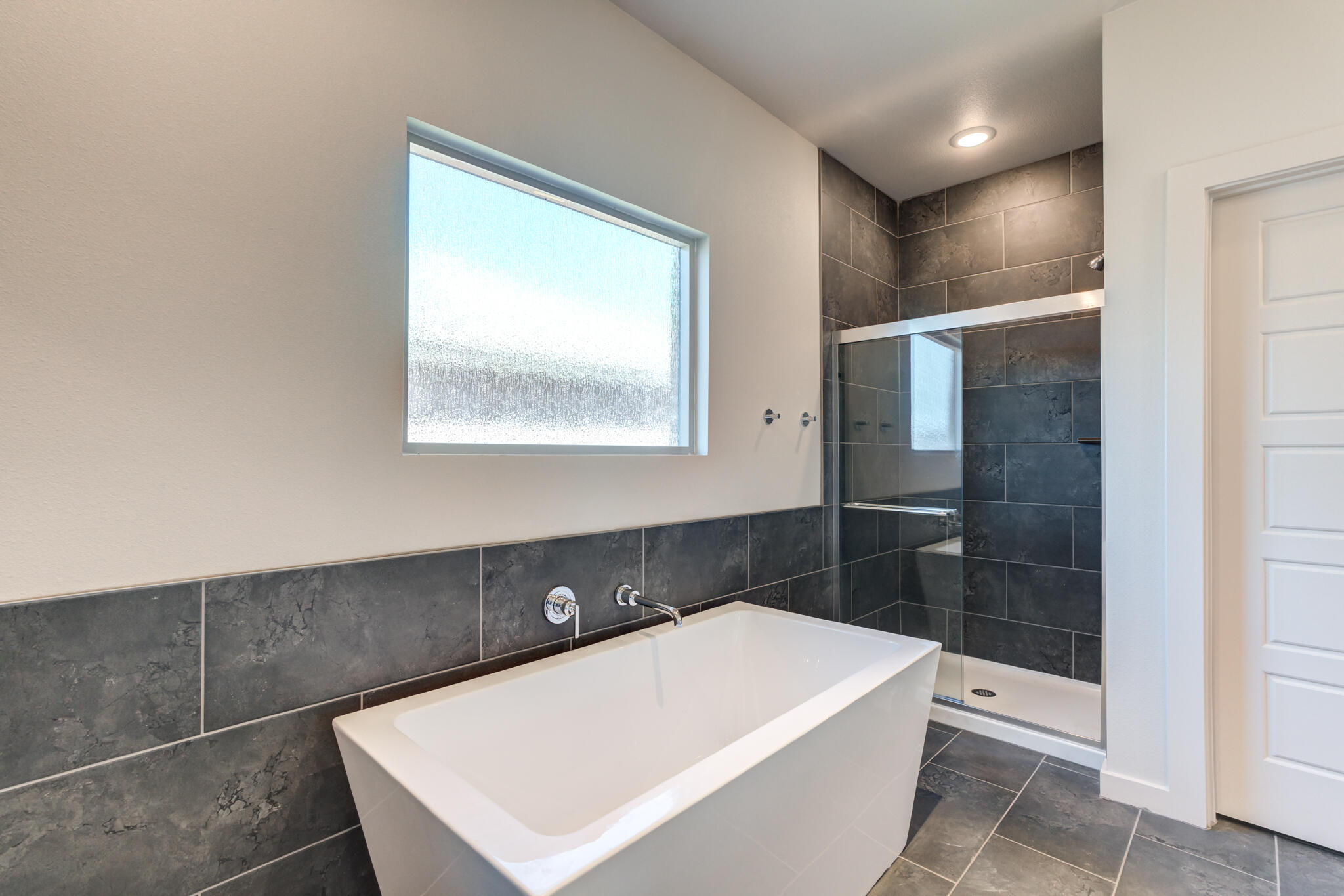 7029 25th Street Lubbock, TX 79407 - Photo 30 of 52 a bathroom with a bathtub and a sink