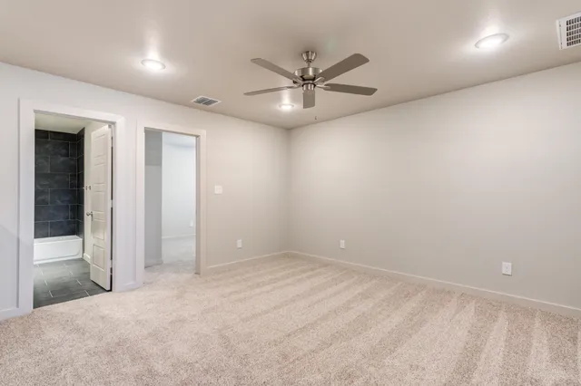 a view of a livingroom with a ceiling fan