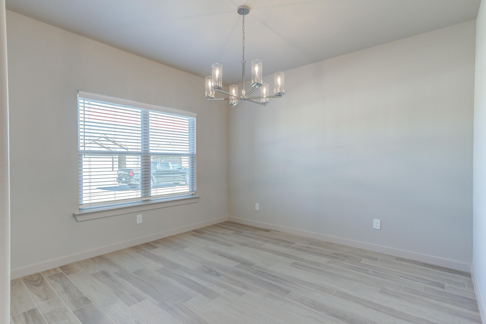 7029 25th Street Lubbock, TX 79407 - Photo 5 of 52 a view of an empty room with a window