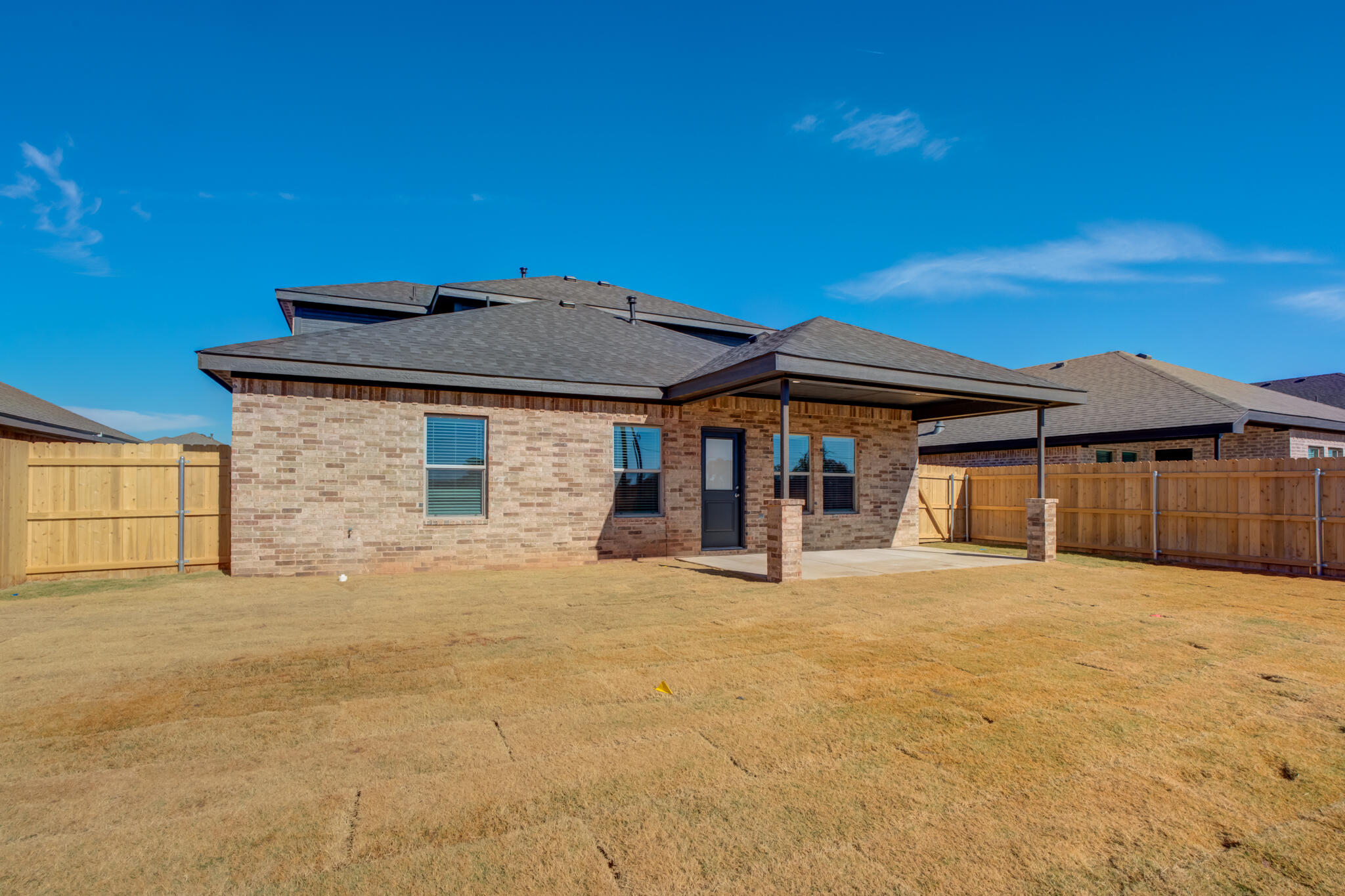 7029 25th Street Lubbock, TX 79407 - Photo 52 of 52 a front view of a house with a yard