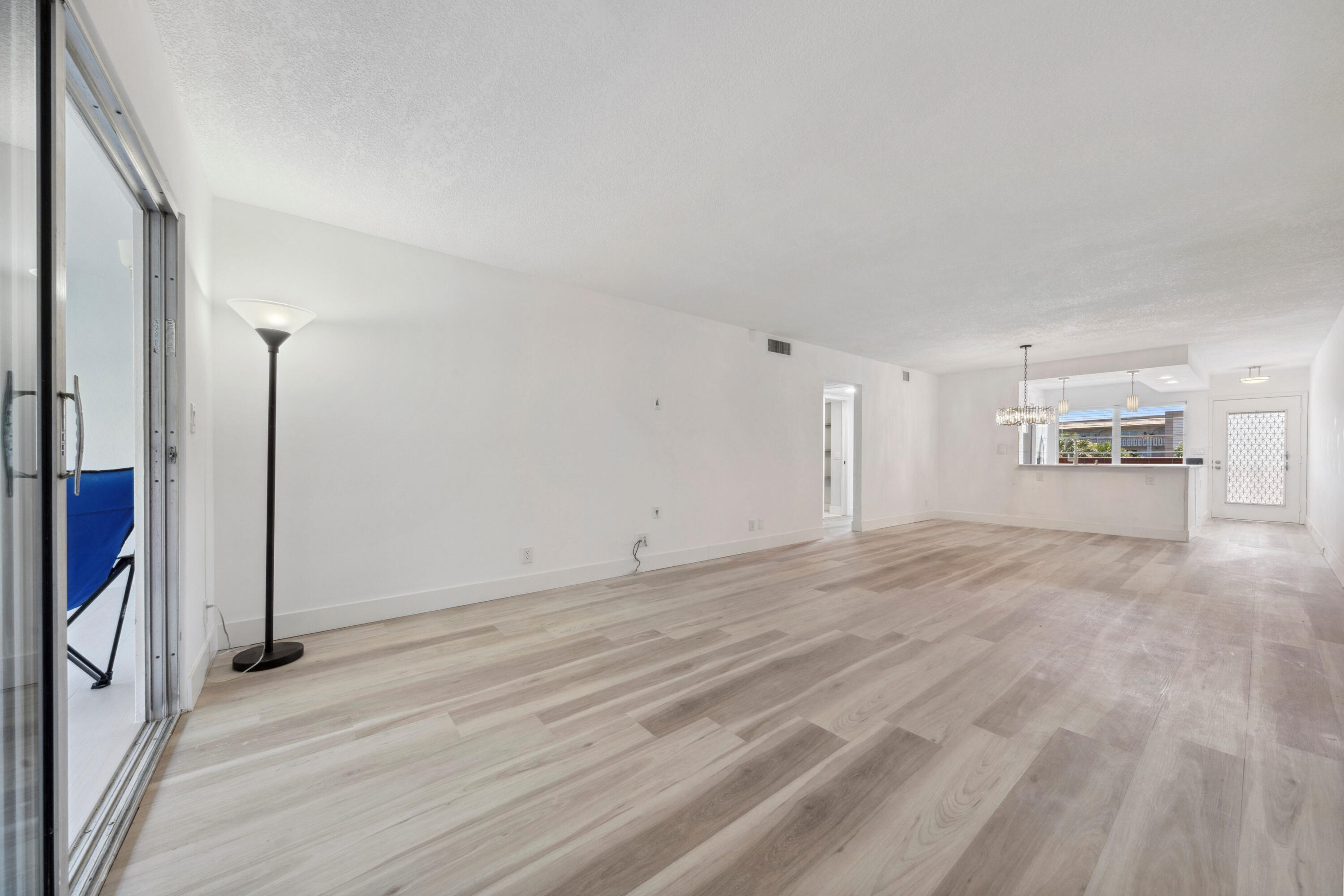 3201 Portofino Point, Unit D3 Coconut Creek, FL 33066 - Photo 11 of 34 a view of empty room with wooden floor