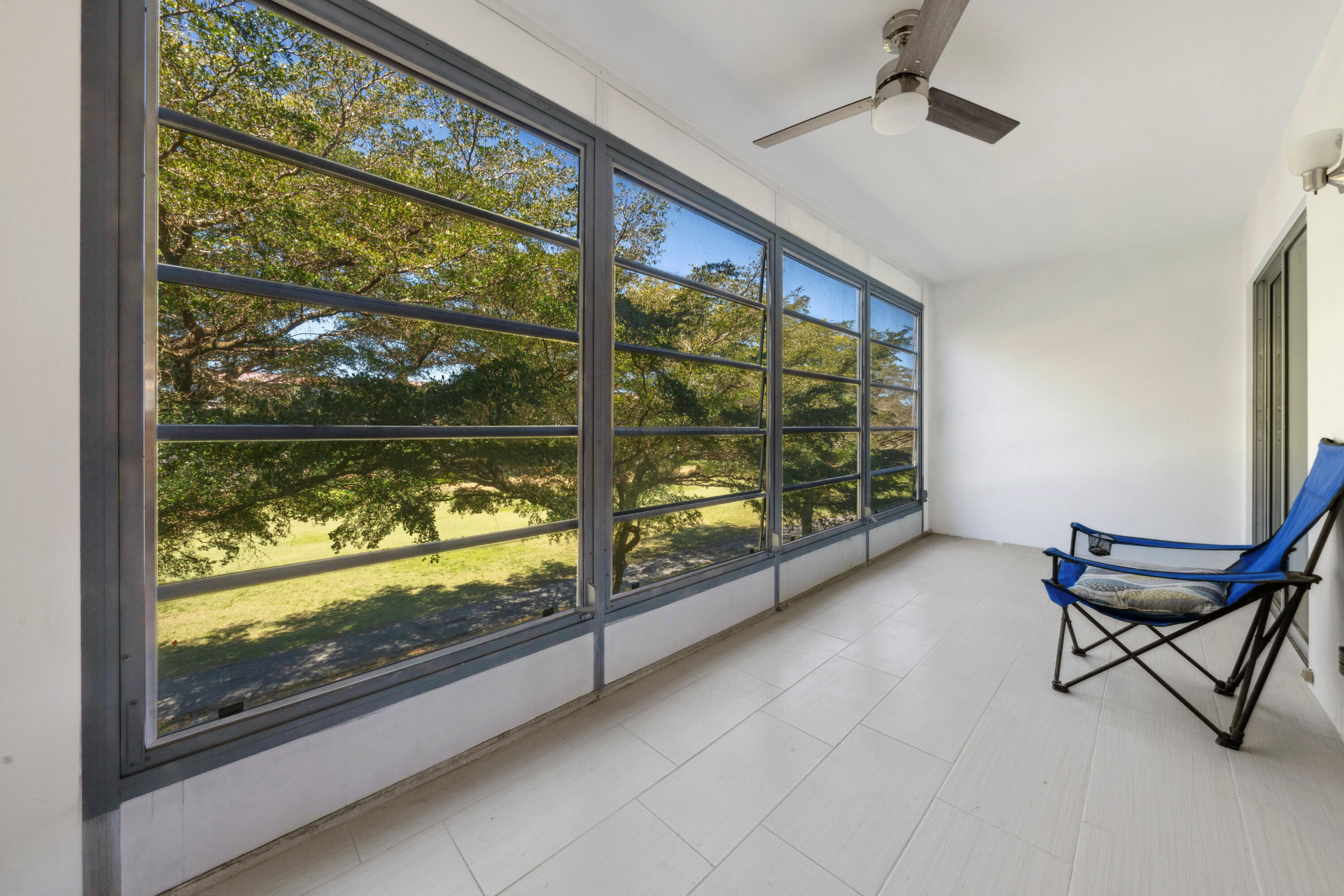 3201 Portofino Point, Unit D3 Coconut Creek, FL 33066 - Photo 12 of 34 a view of a room with wooden floor and outdoor space