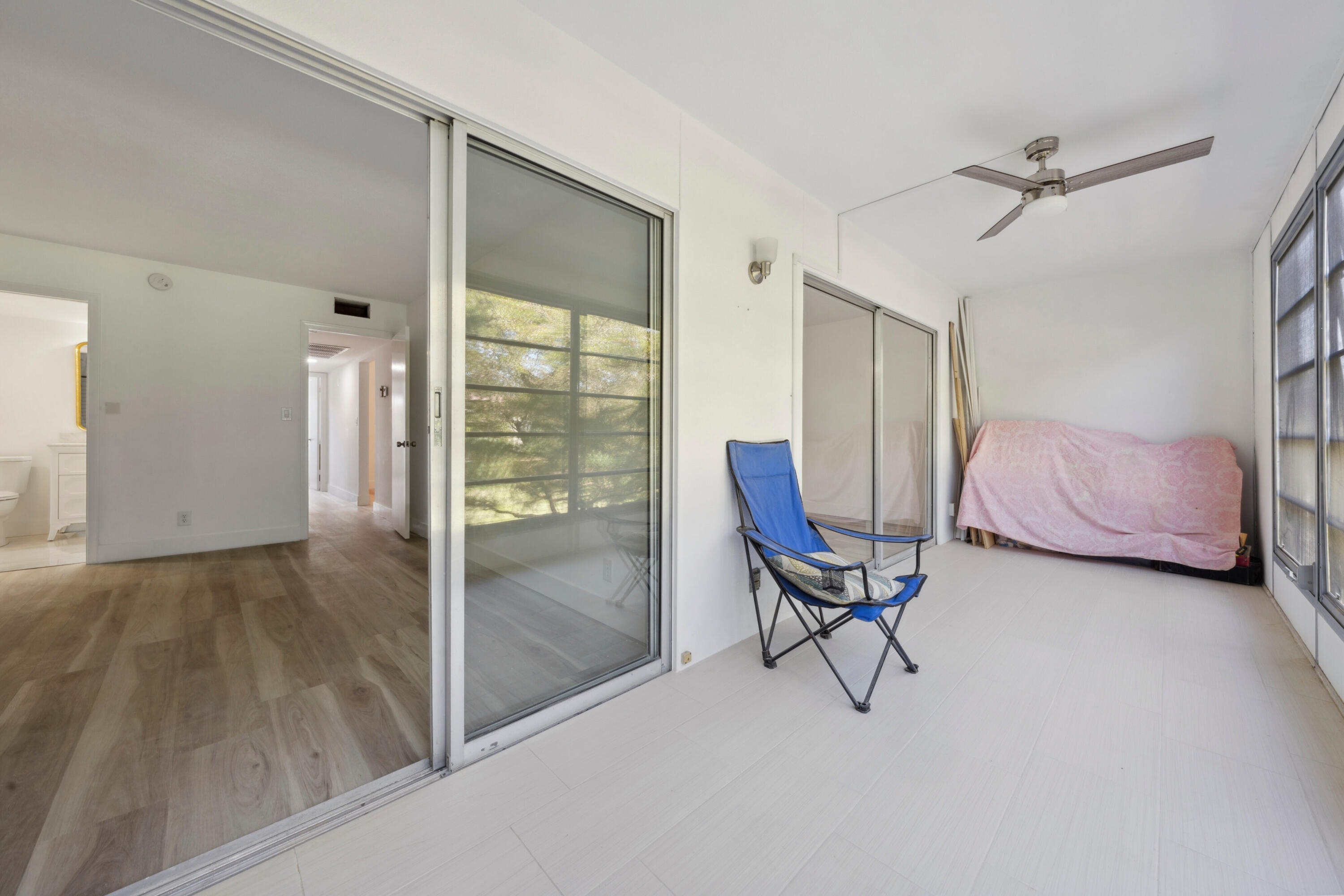 3201 Portofino Point, Unit D3 Coconut Creek, FL 33066 - Photo 14 of 34 a view of a livingroom with furniture and a ceiling fan