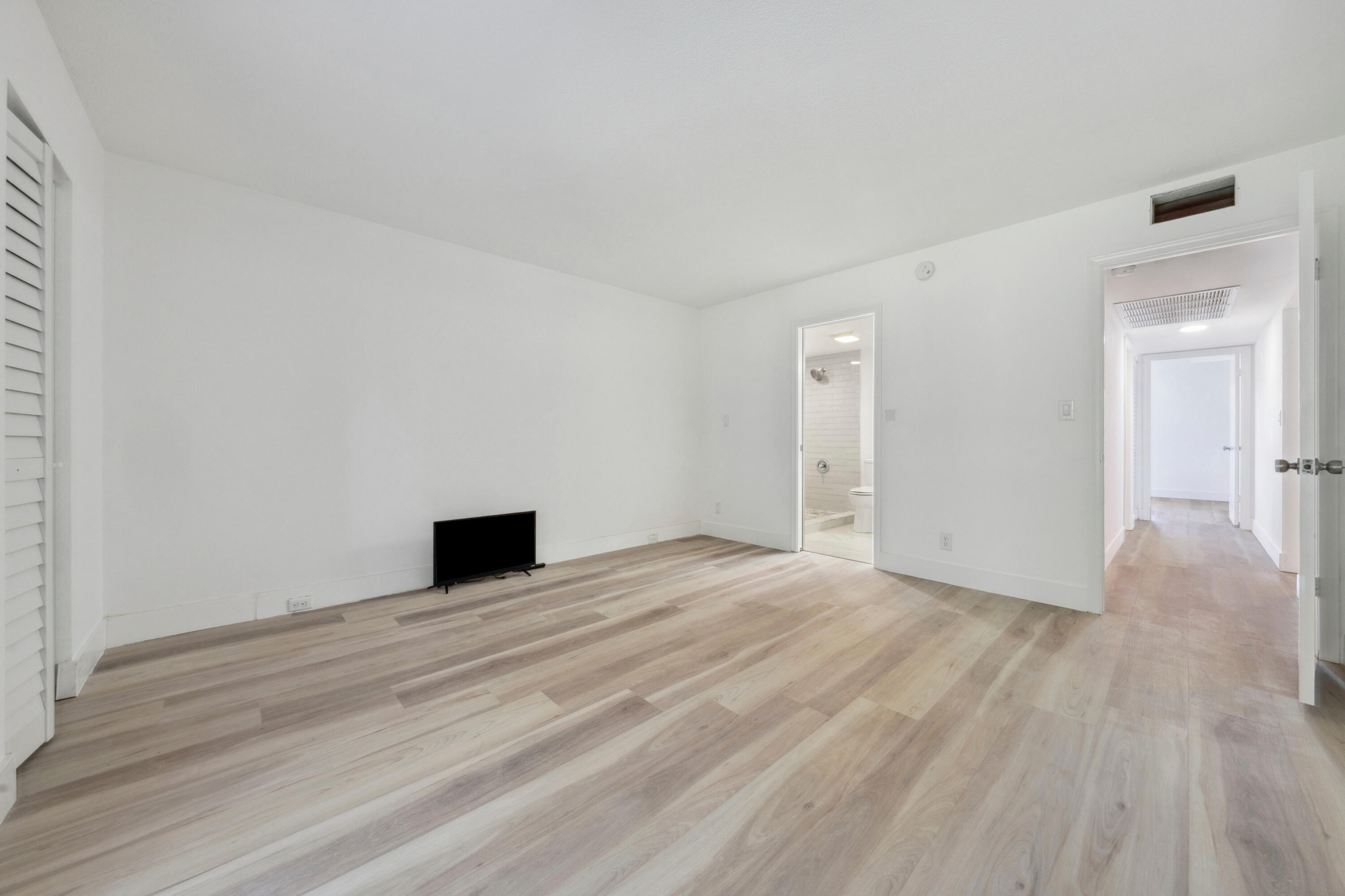 3201 Portofino Point, Unit D3 Coconut Creek, FL 33066 - Photo 15 of 34 a view of empty room with wooden floor