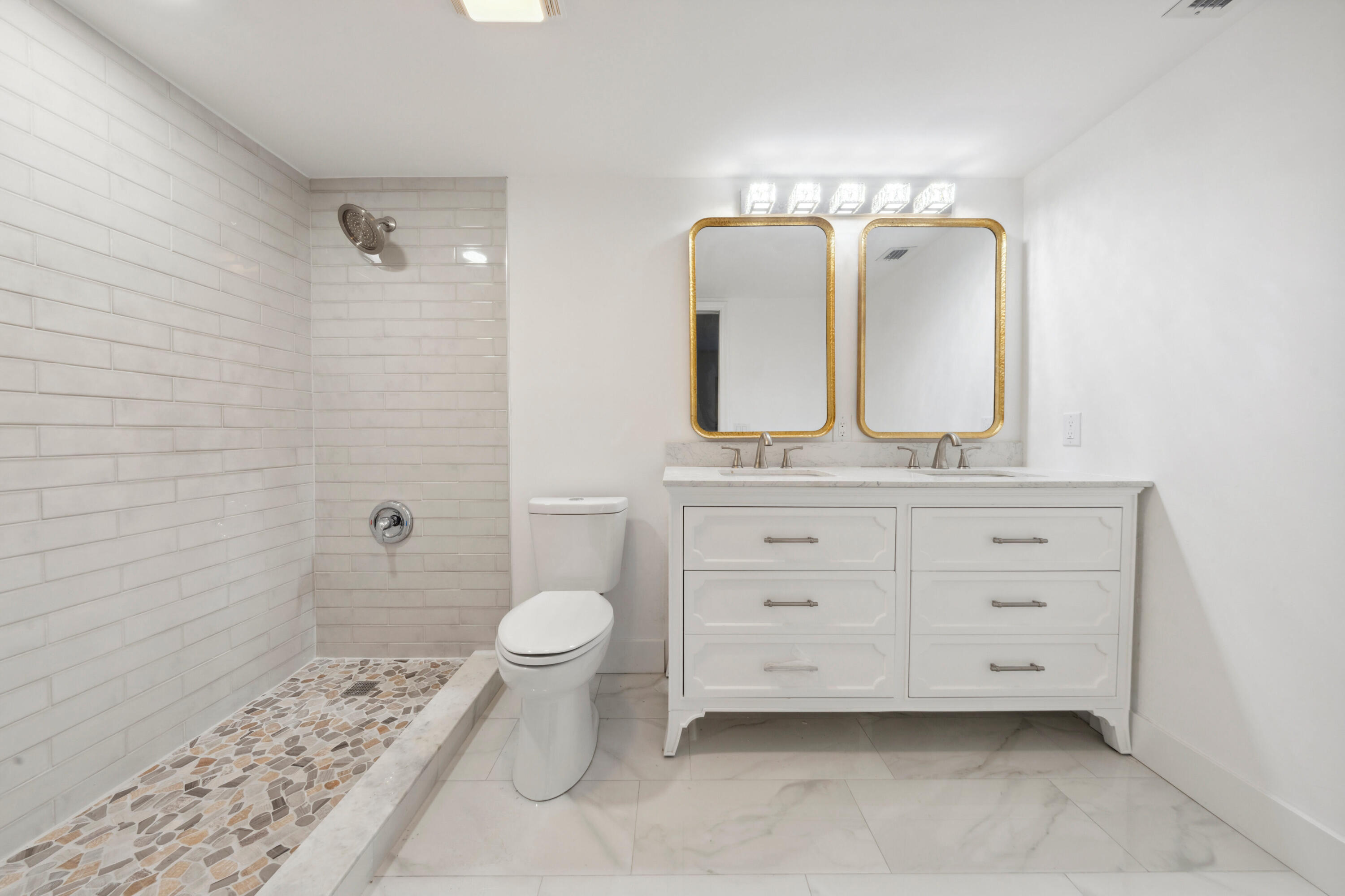 3201 Portofino Point, Unit D3 Coconut Creek, FL 33066 - Photo 17 of 34 a bathroom with a sink a toilet and shower
