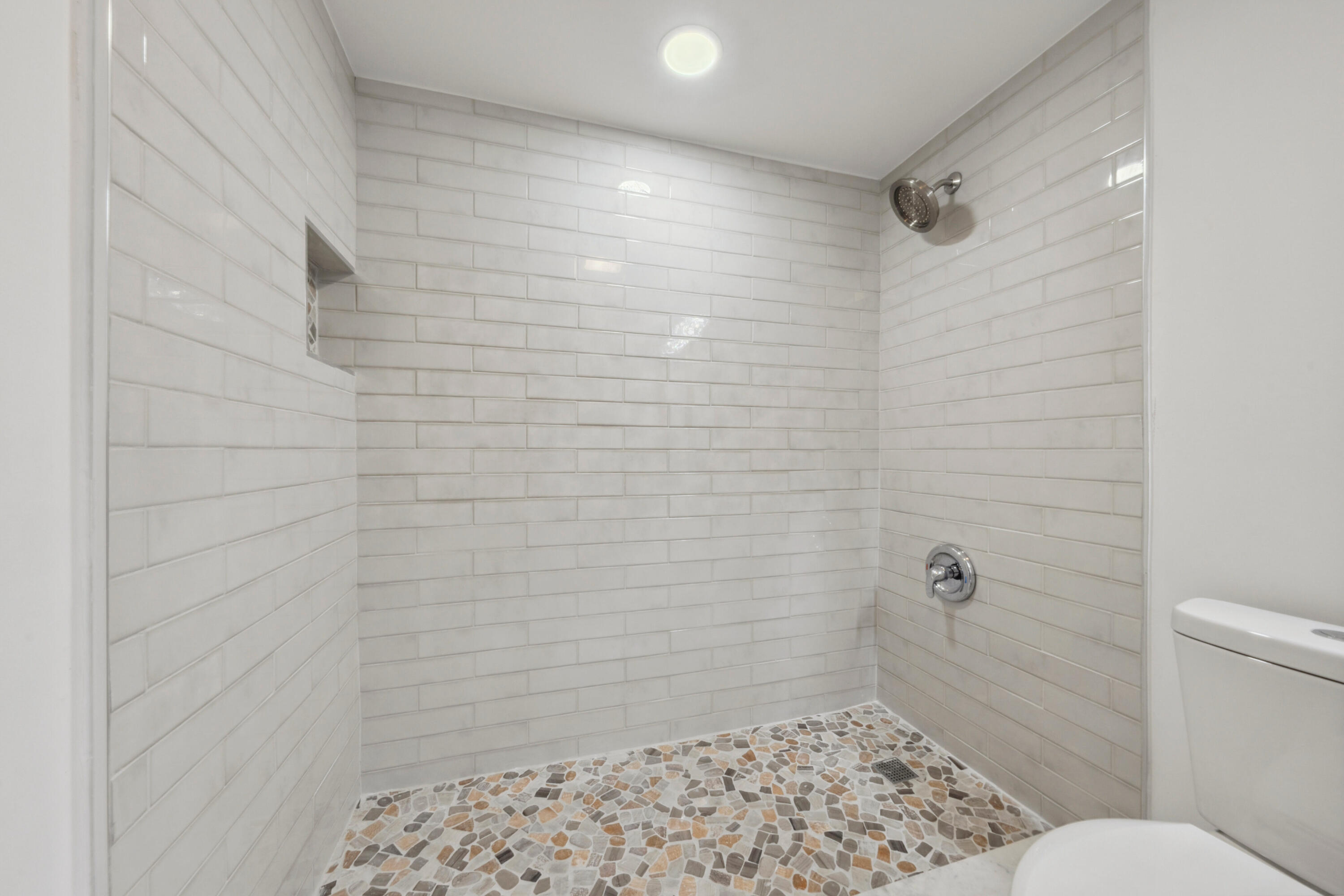 3201 Portofino Point, Unit D3 Coconut Creek, FL 33066 - Photo 18 of 34 a bathroom with a toilet and a shower