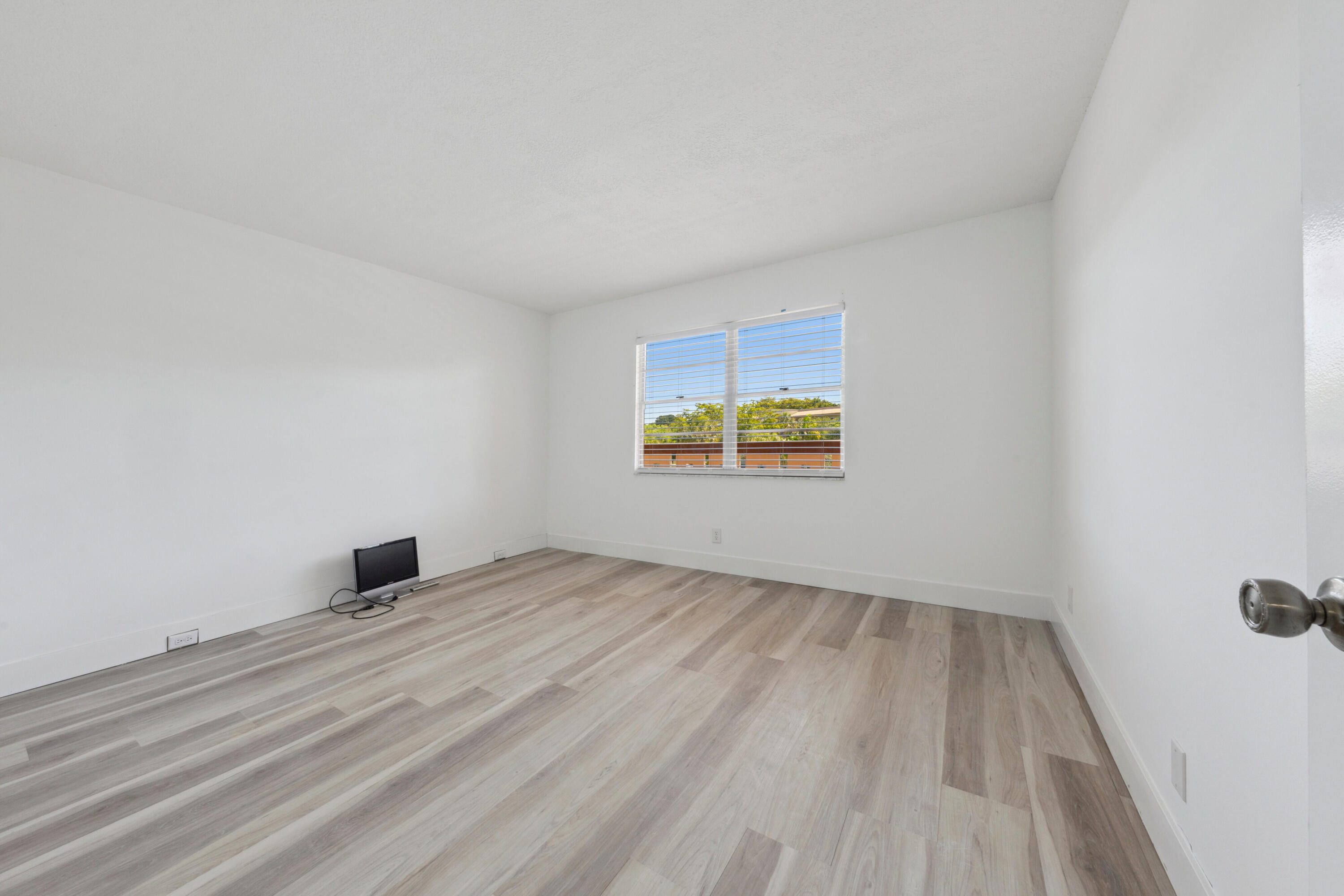 3201 Portofino Point, Unit D3 Coconut Creek, FL 33066 - Photo 19 of 34 a view of an empty room and window