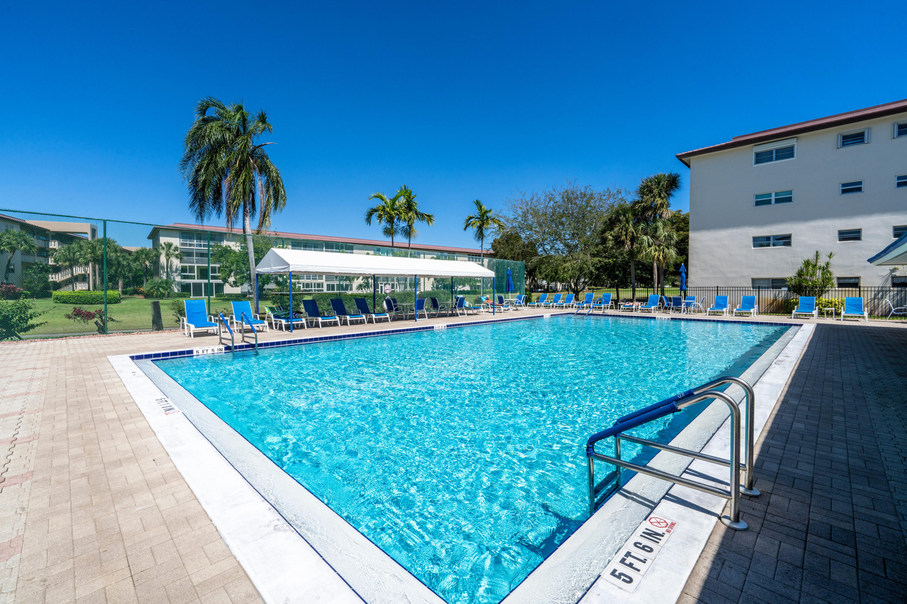 3201 Portofino Point, Unit D3 Coconut Creek, FL 33066 - Photo 25 of 34 a view of swimming pool with outdoor seating and deck