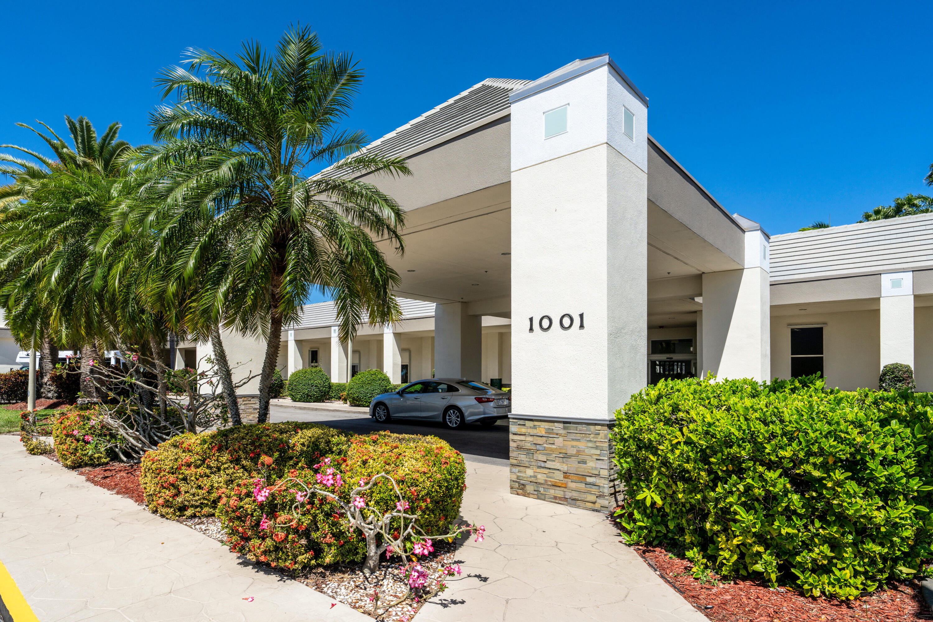 3201 Portofino Point, Unit D3 Coconut Creek, FL 33066 - Photo 29 of 34 a front view of a house with a yard