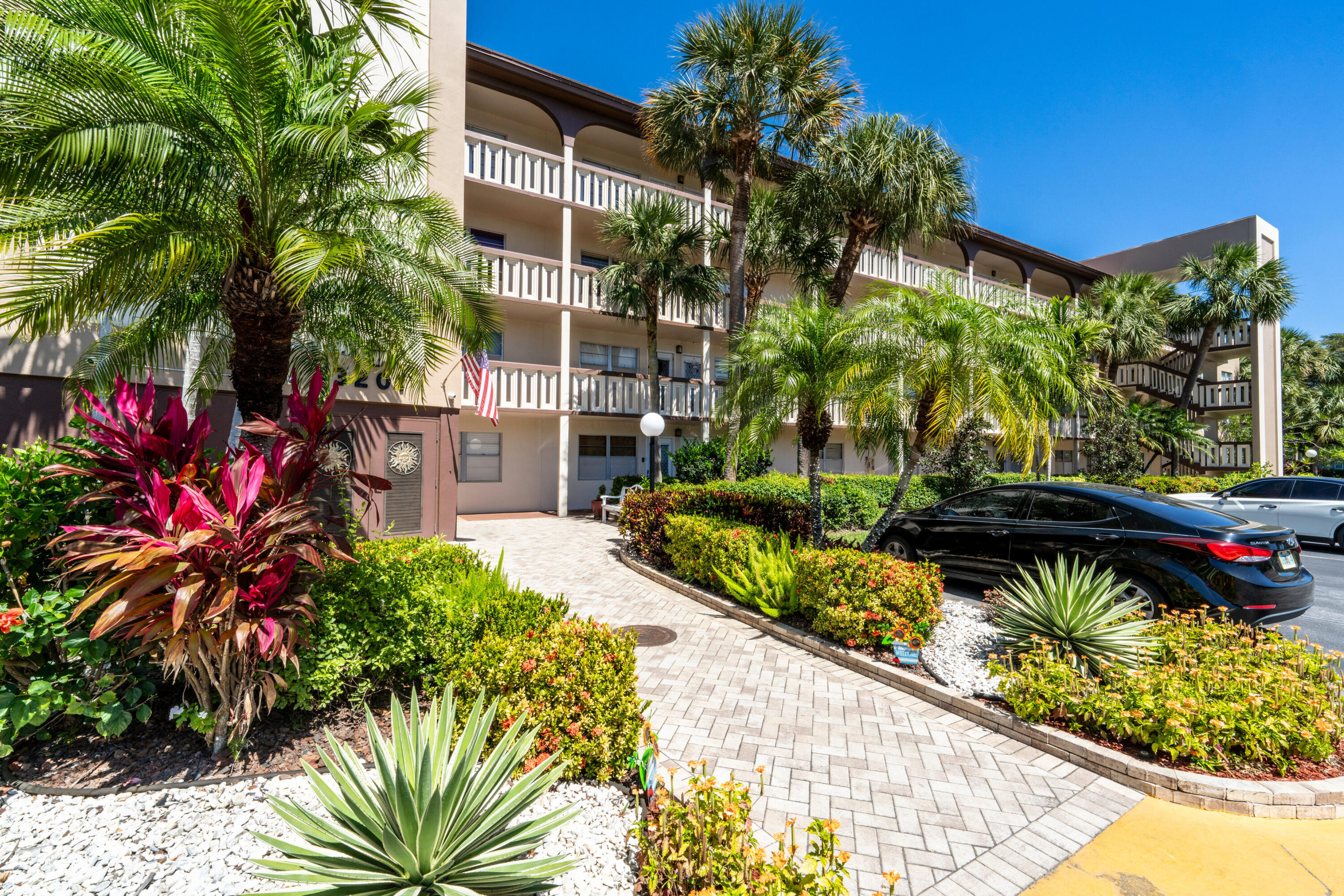3201 Portofino Point, Unit D3 Coconut Creek, FL 33066 - Photo 3 of 34 a view of a house with a yard and fountain