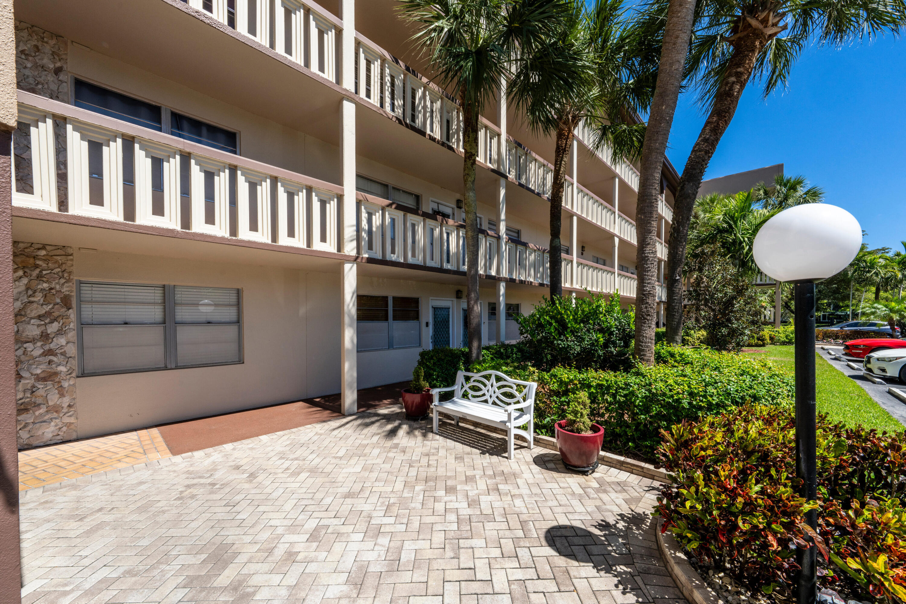 3201 Portofino Point, Unit D3 Coconut Creek, FL 33066 - Photo 4 of 34 a view of a house with backyard and sitting area