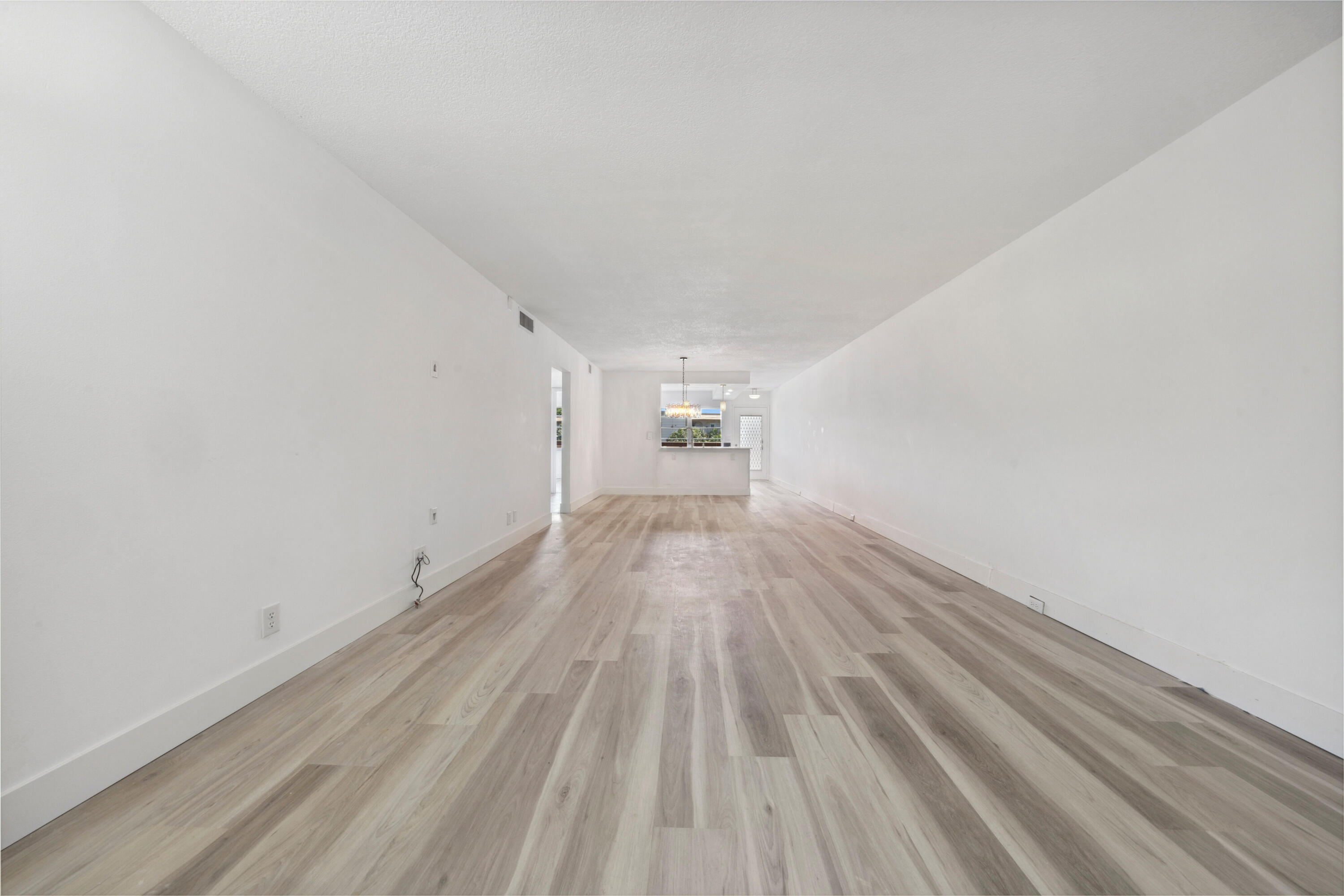 3201 Portofino Point, Unit D3 Coconut Creek, FL 33066 - Photo 10 of 34 a view of empty room with wooden floor