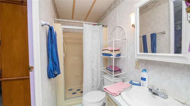 a view of walk in closet with clothes