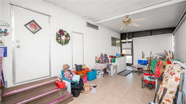 a view of a room with furniture and wooden floor