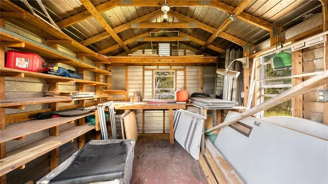 a swimming pool with yard and outdoor seating