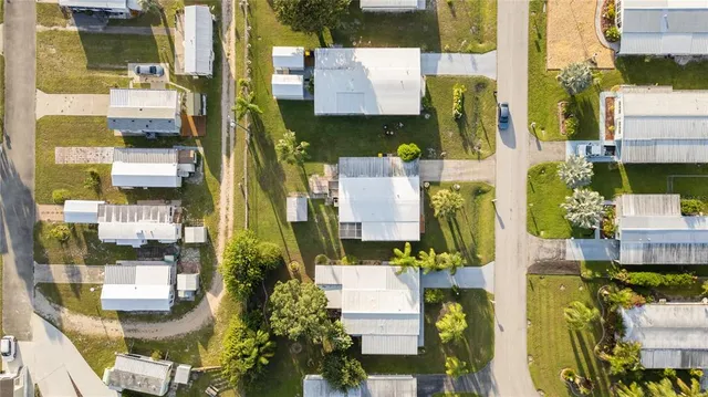 an aerial view of residential houses with city view