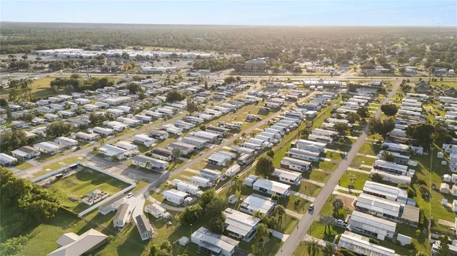 an aerial view of residential building and lake