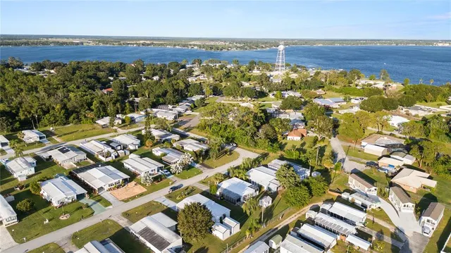 an aerial view of a houses with yard
