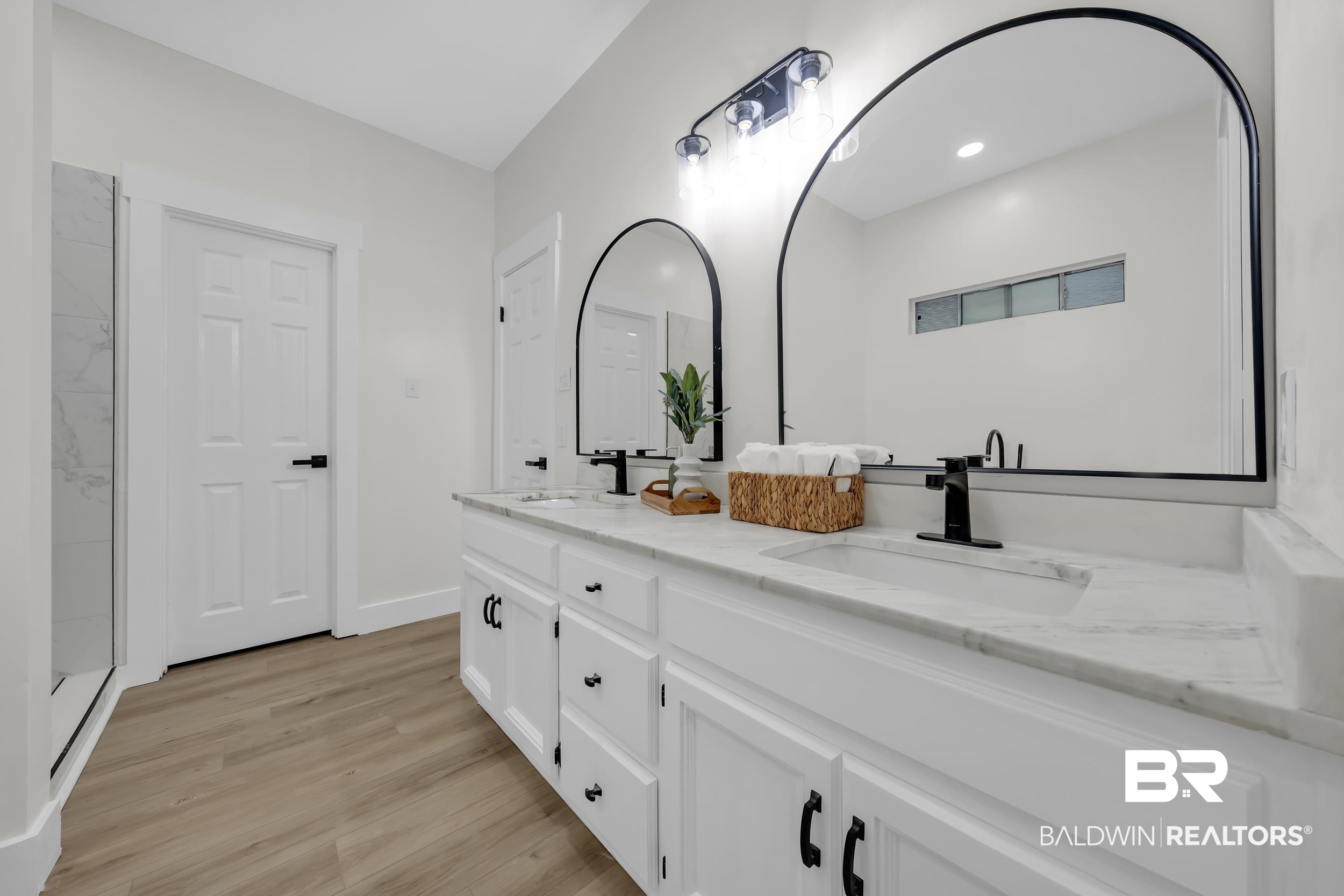 4924 Brooke Court Mobile, AL 36618 - Photo 21 of 34 Bathroom with double vanity and light wood-style flooring