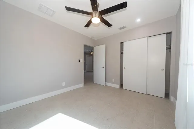 a view of empty room with a fireplace