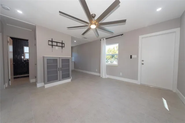 a view of an empty room with a window