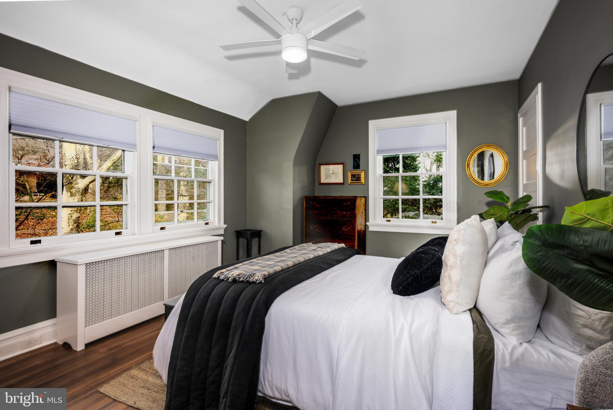 4307 Wickford Road Baltimore, MD 21210 - Photo 17 of 38 a bedroom with a bed and a large window with the outer view