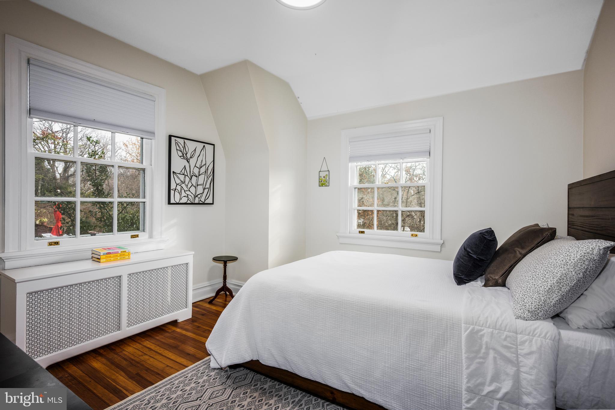 4307 Wickford Road Baltimore, MD 21210 - Photo 22 of 38 a bedroom with a bed and a window