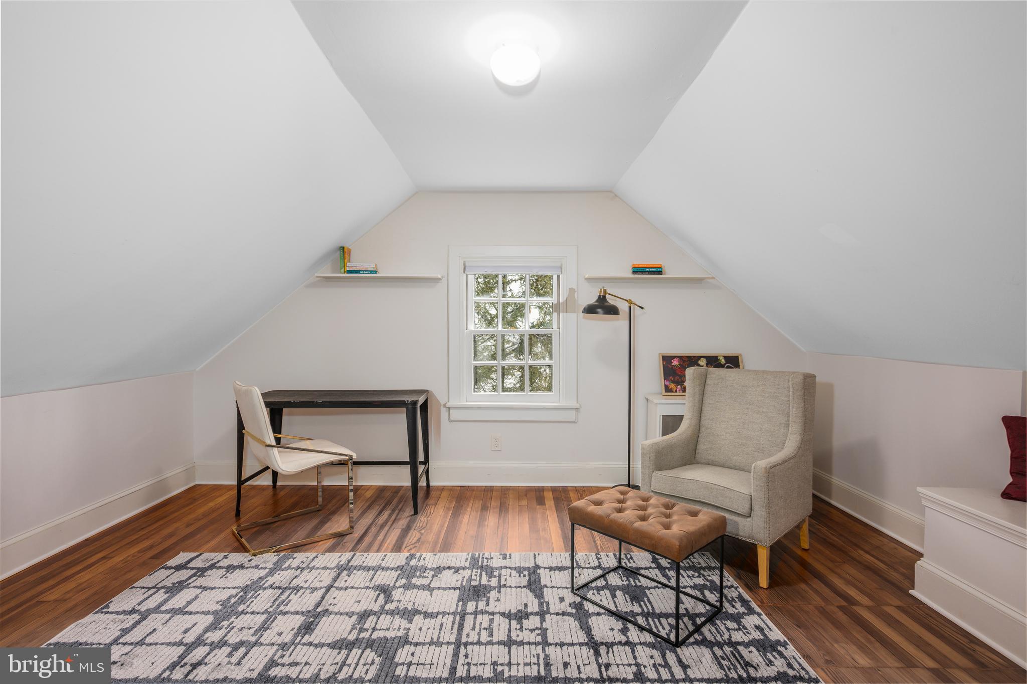 4307 Wickford Road Baltimore, MD 21210 - Photo 28 of 38 a living room with a couch and a rug