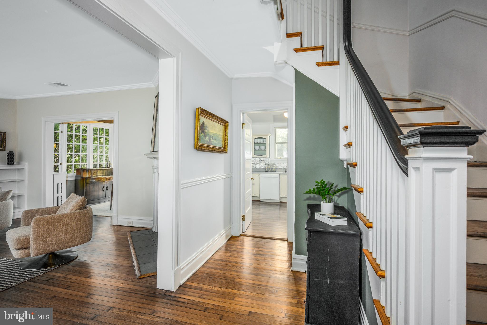 4307 Wickford Road Baltimore, MD 21210 - Photo 3 of 38 a view of a hallway with wooden floor and staircase